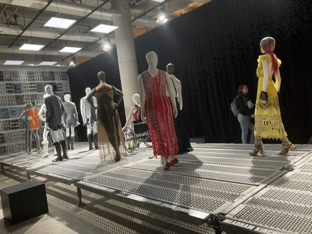 Designer collections are displayed in the runway section. 